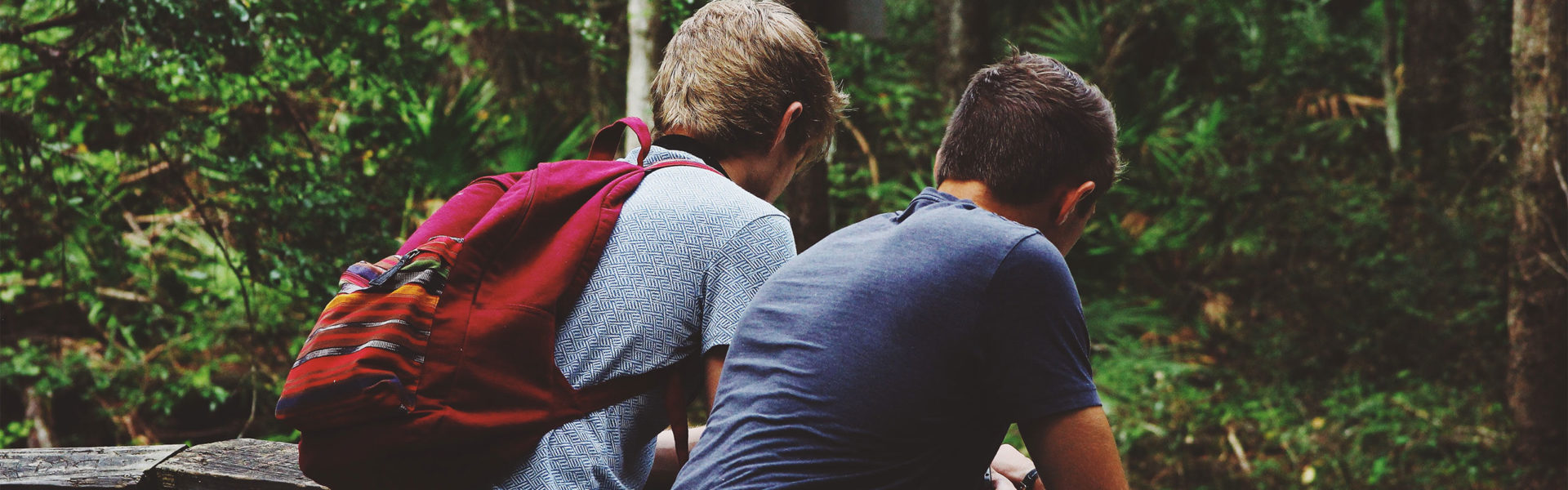 Internet Safety for Kids Two Teen Boys In The Woods Looking At Phones