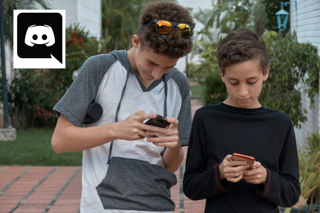 Discord Parental Control - two young teen boys on smartphones