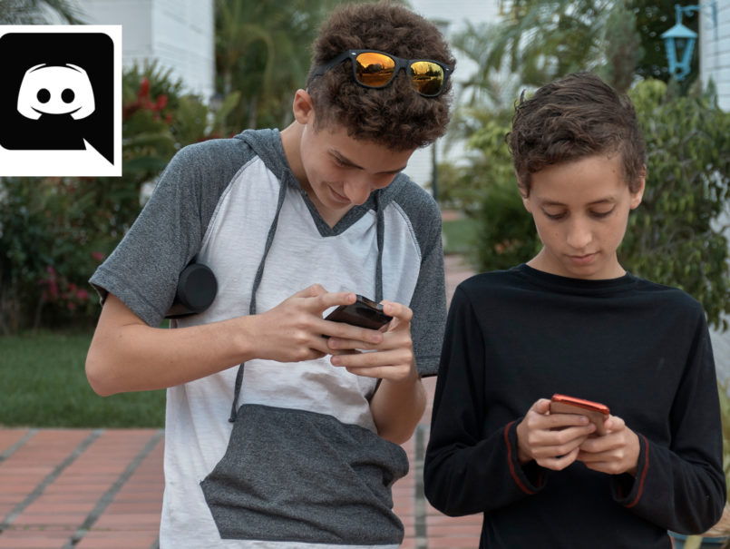 Discord Parental Control - two young teen boys on smartphones