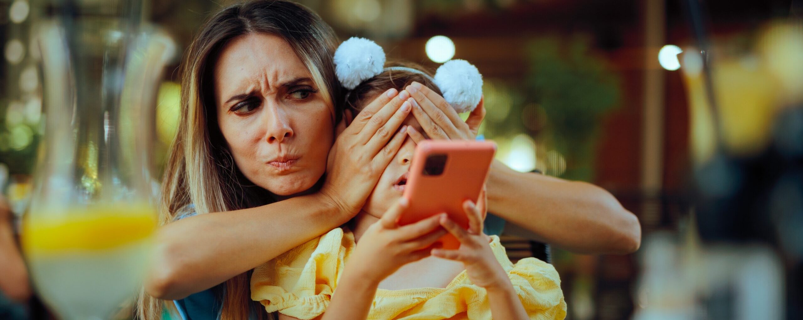 Mother,Covering,Daughter,Eyes,Preventing,Her,To,Watch,Social,Media.